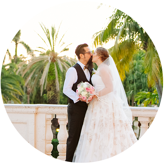 bride and groom outside kissing