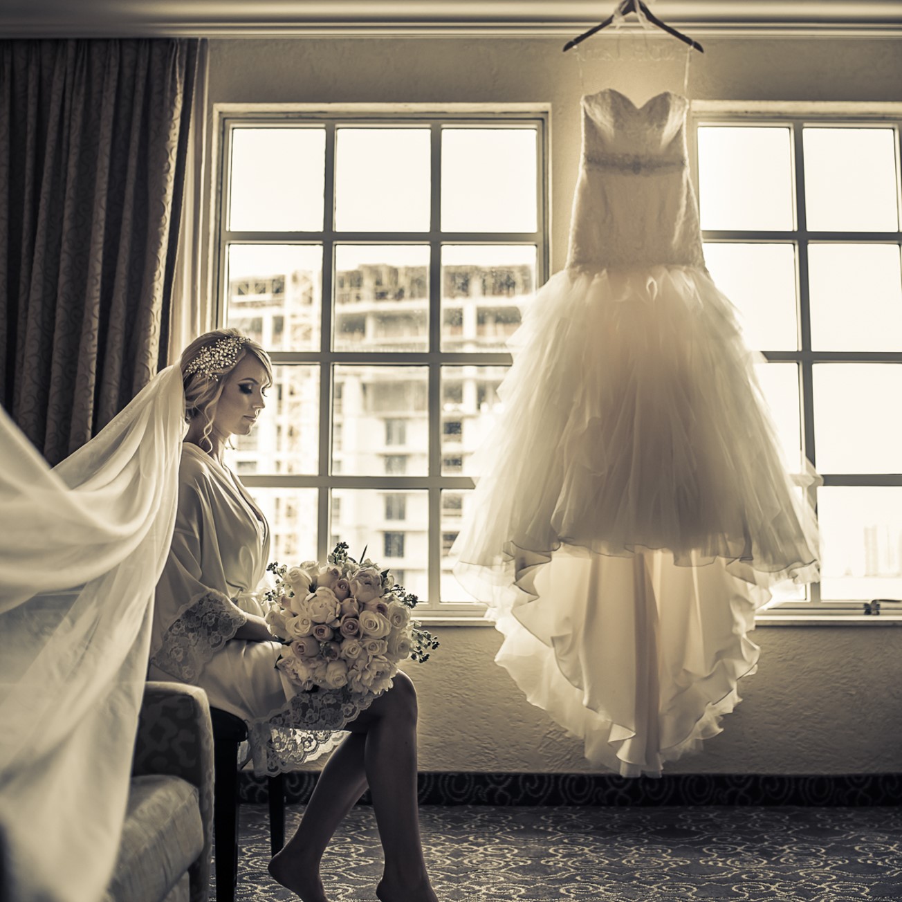bridal suite with wedding dress and bouquet